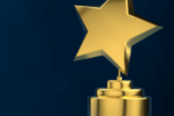 A gleaming gold star award atop a gold pedestal against a dark blue background.